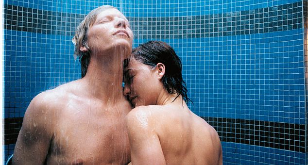 Young couple having a shower --- Image by © Jonny Le Fortune/Corbis